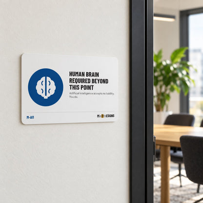 MindTheSigns funny sign “Human Brain Required Beyond This Point” in English, aluminium 30×20 cm, shown on an office wall
