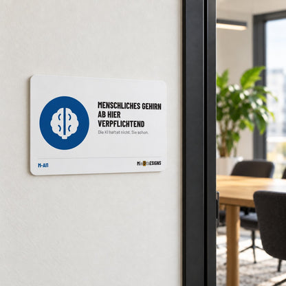 MindTheSigns funny sign “Human Brain Required Beyond This Point” in German, aluminium 30×20 cm, shown on an office wall