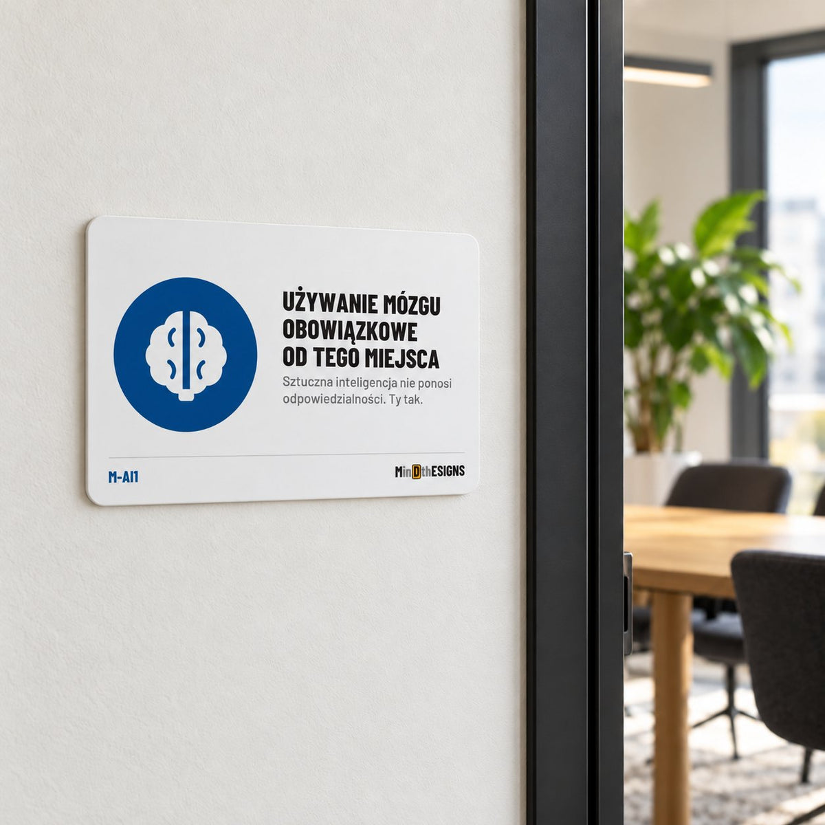 MindTheSigns funny sign “Human Brain Required Beyond This Point” in Polish, aluminium 30×20 cm, shown on an office wall